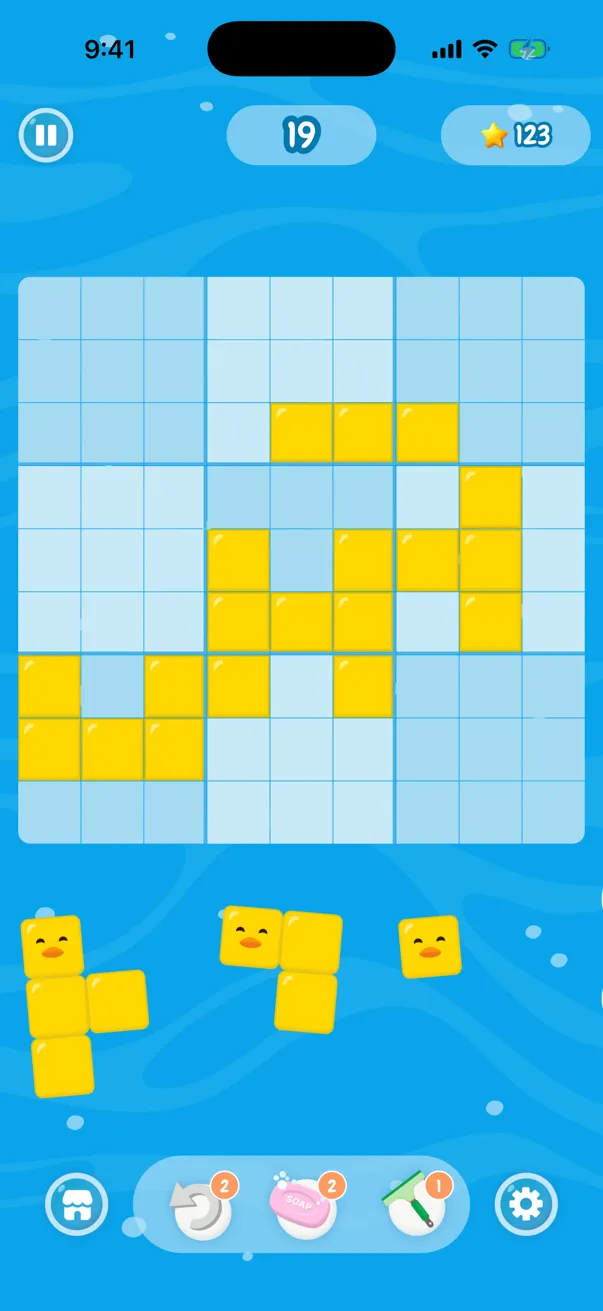 A game of Ducks In a Row in progress, with yellow duck bricks placed across a 9 by 9 board
